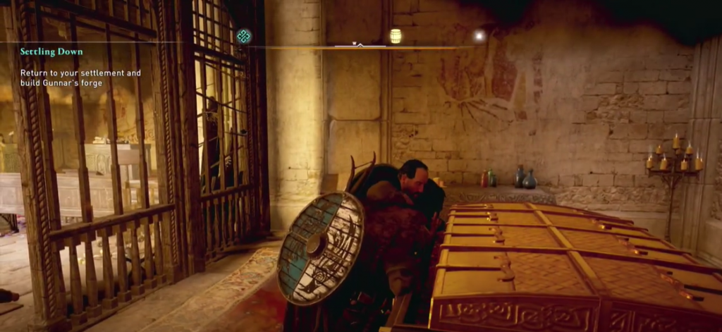 Assassin's Creed Valhalla looting a large golden chest in an English monastery