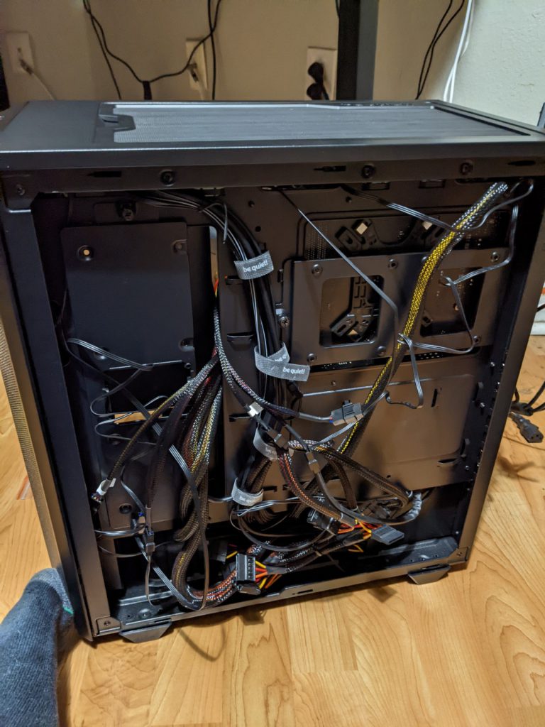 Back of be quiet! PC case with cords mostly organized