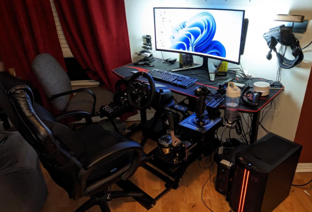 My old gaming chair next to by desktop with all my sim gear on display