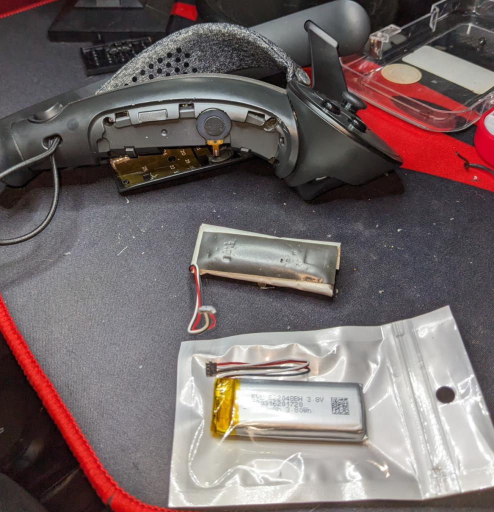 Disassembled Valve Index Controller with old and replacement battery