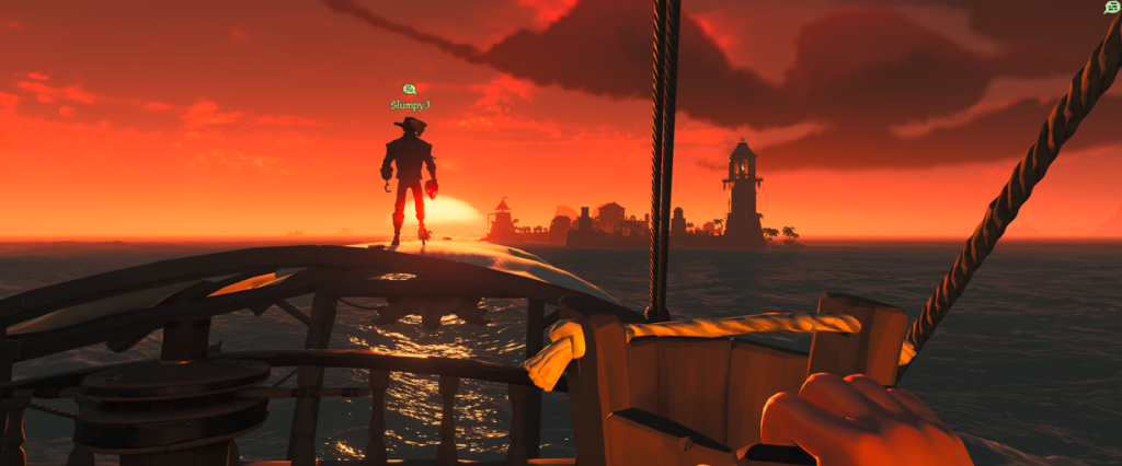 Sea of Thieves watching the sunset from our sloop with my son standing watch and outpost in the distance