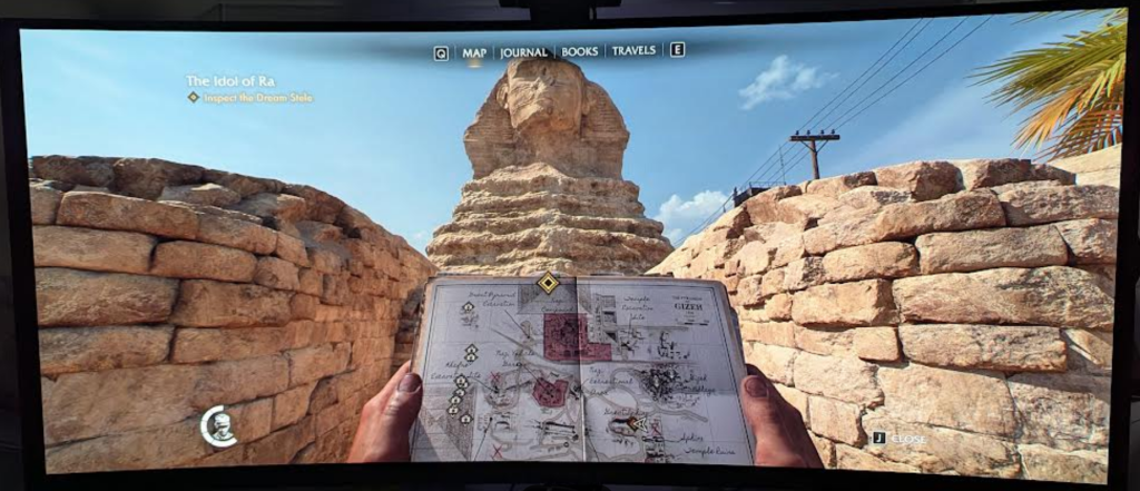 Indiana Jones GOTY and the Great Circle looking at the notebook in at the base of the Sphinx in Egypt